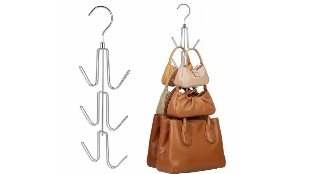 Vertical metal purse hanger holding multiple leather handbags in a closet